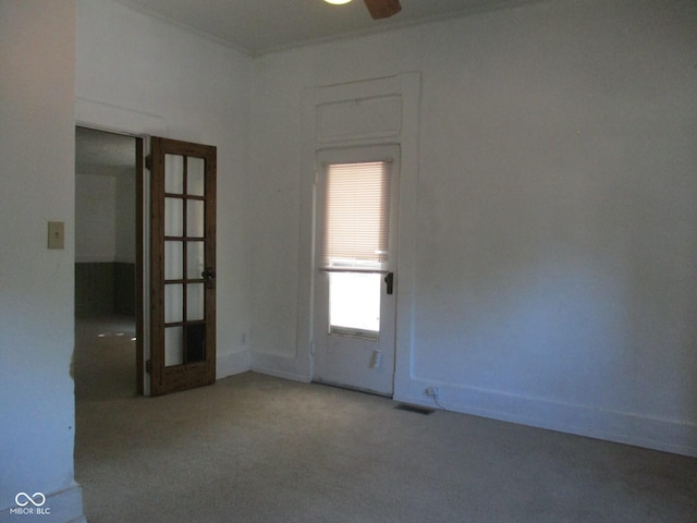 302 Lincoln St, Crawfordsville, IN 47933 - spare room with carpet, a ceiling fan, and french doors