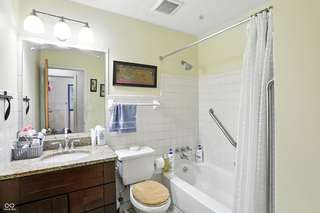 5560 Royal Oak Ct, Indianapolis, IN 46227 - bathroom featuring tile walls, vanity, and shower / bath combo with shower curtain