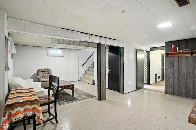 5560 Royal Oak Ct, Indianapolis, IN 46227 - finished basement featuring tile patterned floors, stairway, wood walls, and bar area