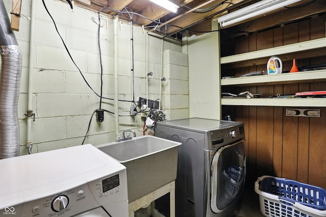 5560 Royal Oak Ct, Indianapolis, IN 46227 - laundry area with concrete block wall and washing machine and clothes dryer