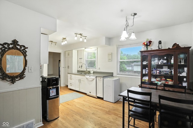 5560 Royal Oak Ct, Indianapolis, IN 46227 - kitchen with dishwasher, light wood-type flooring, white cabinetry, a chandelier, and decorative light fixtures