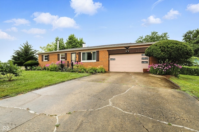 5560 Royal Oak Ct, Indianapolis, IN 46227 - ranch-style house featuring brick siding, a garage, a front lawn, driveway, and a chimney