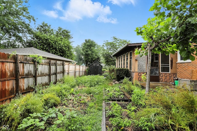 5560 Royal Oak Ct, Indianapolis, IN 46227 - fenced backyard featuring a garden and a shed