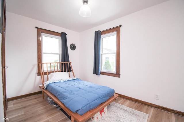 1606 California St, Columbus, IN 47201 - bedroom with baseboards and light wood-style flooring