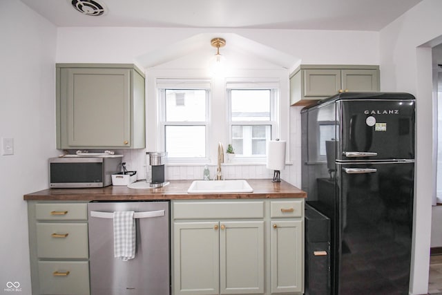 1606 California St, Columbus, IN 47201 - kitchen with appliances with stainless steel finishes, butcher block counters, and backsplash