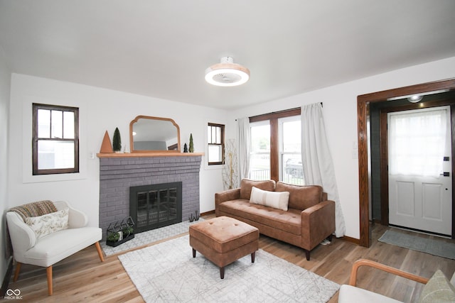 1606 California St, Columbus, IN 47201 - living area featuring light wood-style floors and a brick fireplace