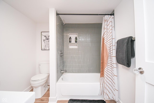 1606 California St, Columbus, IN 47201 - full bathroom with wood finished floors and shower / bathtub combination with curtain