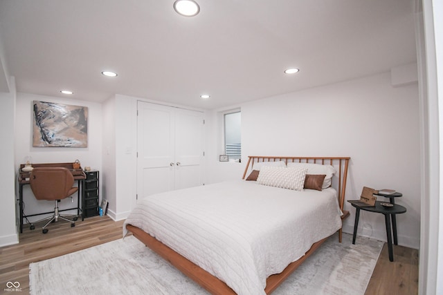 1606 California St, Columbus, IN 47201 - bedroom with wood finished floors, recessed lighting, an office area, and a closet