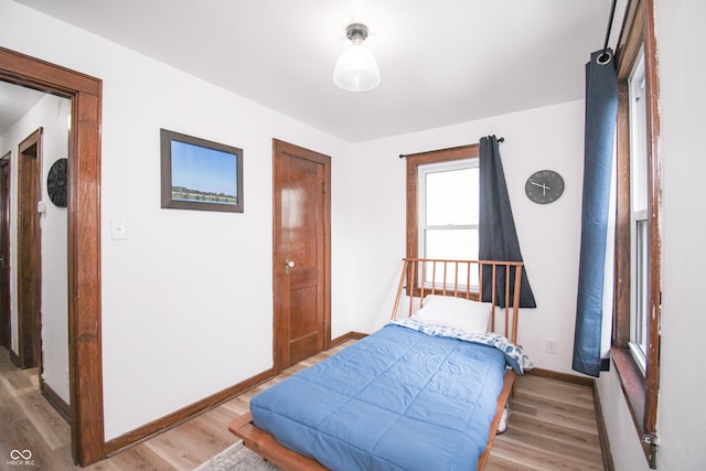 1606 California St, Columbus, IN 47201 - bedroom with light wood finished floors and baseboards