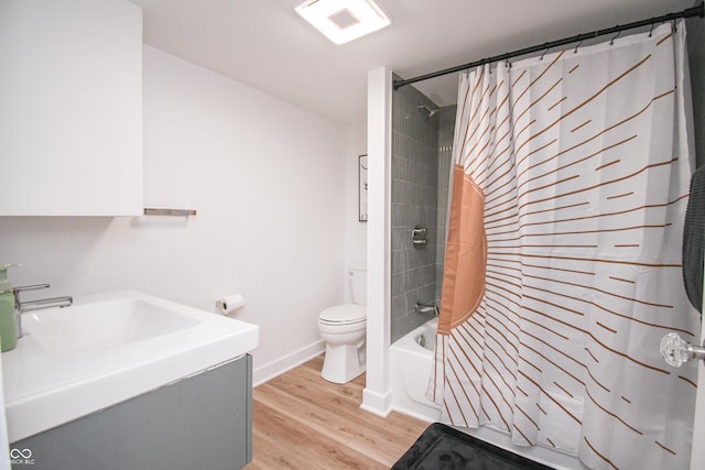 1606 California St, Columbus, IN 47201 - full bath with shower / bath combination with curtain, wood finished floors, and vanity