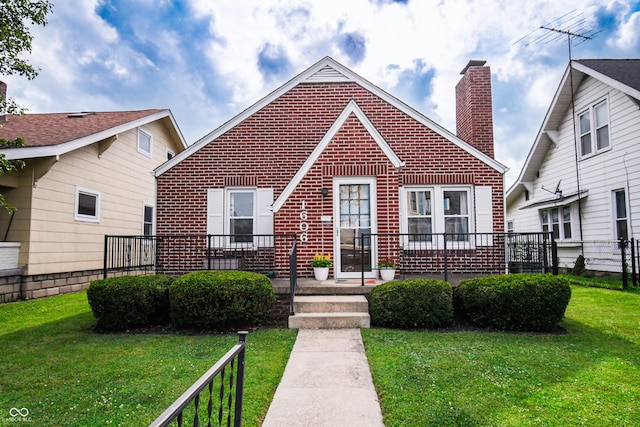 1606 California St, Columbus, IN 47201 - view of front of house featuring brick siding and a chimney