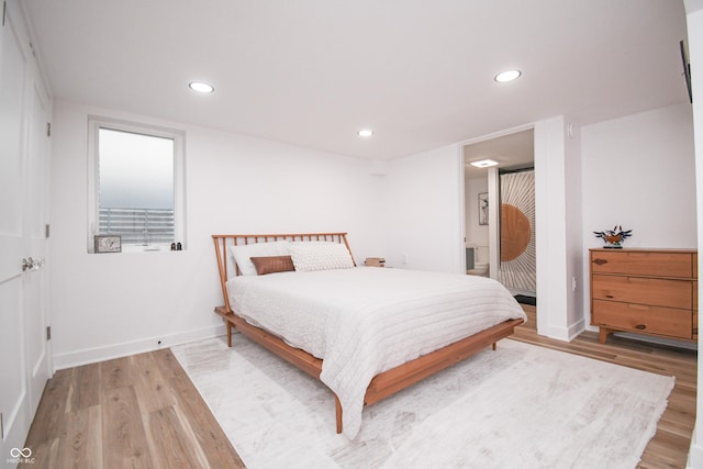 1606 California St, Columbus, IN 47201 - bedroom with wood finished floors, recessed lighting, and connected bathroom