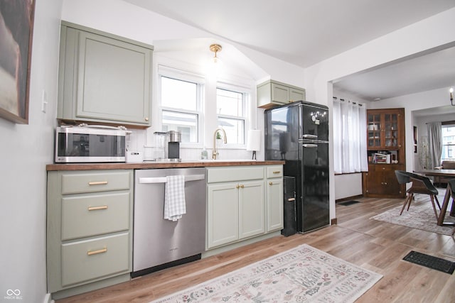 1606 California St, Columbus, IN 47201 - kitchen with appliances with stainless steel finishes, plenty of natural light, and light wood-type flooring