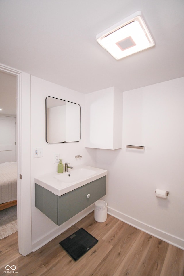 1606 California St, Columbus, IN 47201 - ensuite bathroom with vanity and wood finished floors