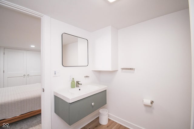 1606 California St, Columbus, IN 47201 - bathroom featuring vanity and wood finished floors