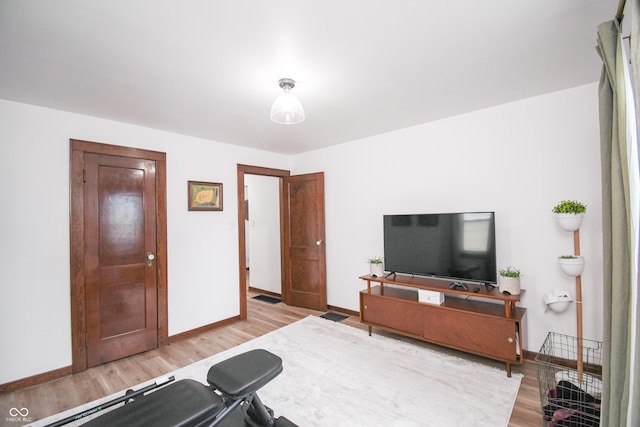 1606 California St, Columbus, IN 47201 - exercise area with wood finished floors and baseboards