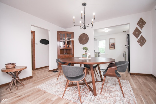 1606 California St, Columbus, IN 47201 - dining space featuring light wood finished floors and a chandelier