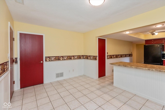 5038 Hawthorne Way, Avon, IN 46123 - kitchen with freestanding refrigerator, wainscoting, and a ceiling fan