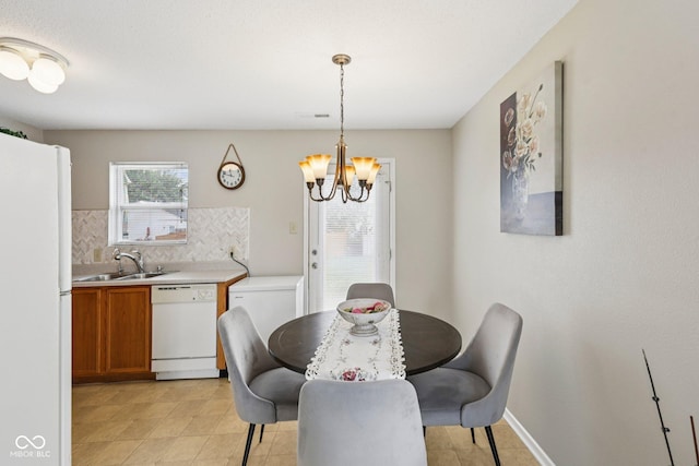 7930 Cork Bend Ln, Indianapolis, IN 46239 - dining space with a chandelier and light tile patterned floors