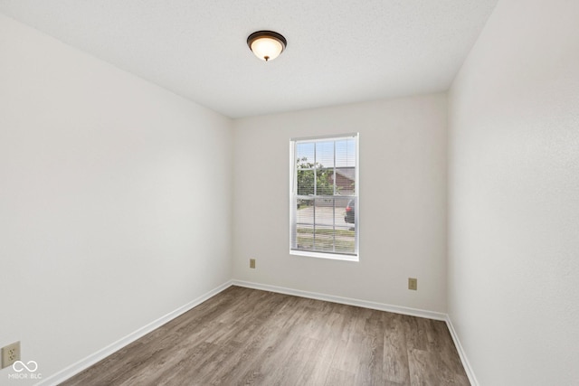 7930 Cork Bend Ln, Indianapolis, IN 46239 - unfurnished room with wood finished floors and baseboards