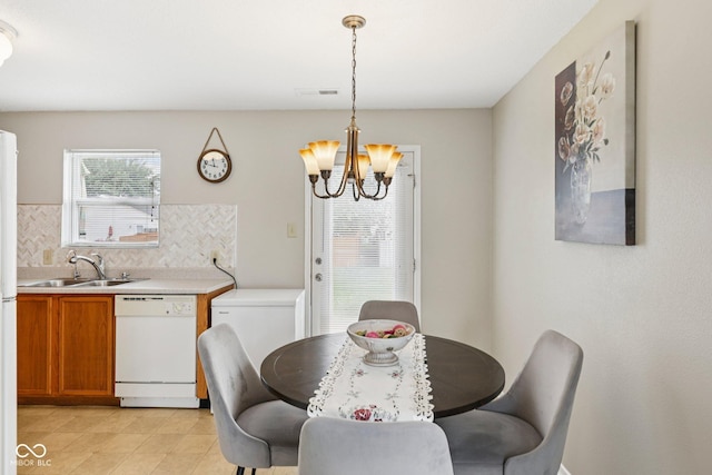 7930 Cork Bend Ln, Indianapolis, IN 46239 - dining room featuring a chandelier and light tile patterned floors