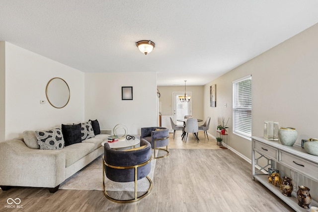 7930 Cork Bend Ln, Indianapolis, IN 46239 - living area with wood finished floors and a chandelier