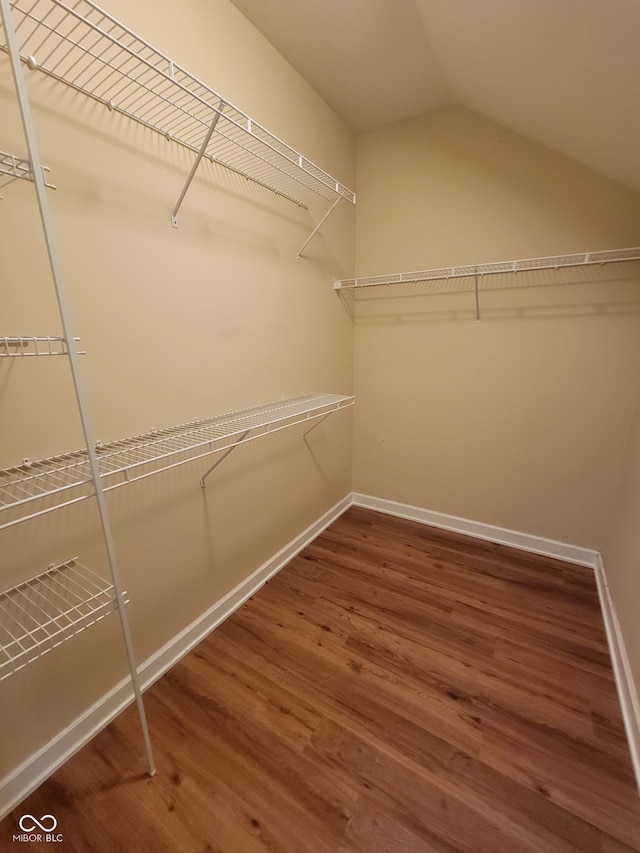 1096 Shadow Ridge Rd, Carmel, IN 46280 - walk in closet featuring wood finished floors and vaulted ceiling
