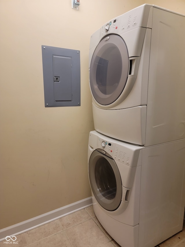 1096 Shadow Ridge Rd, Carmel, IN 46280 - laundry area with stacked washing machine and dryer, electric panel, and light tile patterned floors