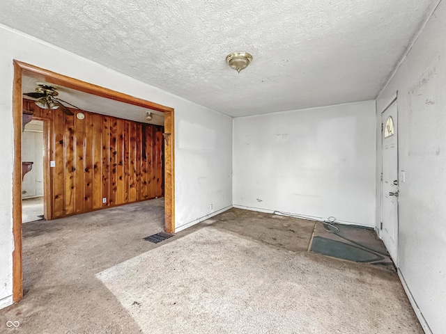 1518 S Goodlet Ave, Indianapolis, IN 46241 - spare room with carpet floors, a textured ceiling, and ceiling fan