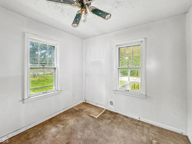 1518 S Goodlet Ave, Indianapolis, IN 46241 - carpeted spare room featuring plenty of natural light, ceiling fan, and a textured ceiling