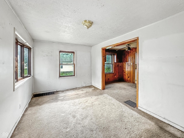 1518 S Goodlet Ave, Indianapolis, IN 46241 - carpeted spare room with a textured ceiling and ceiling fan
