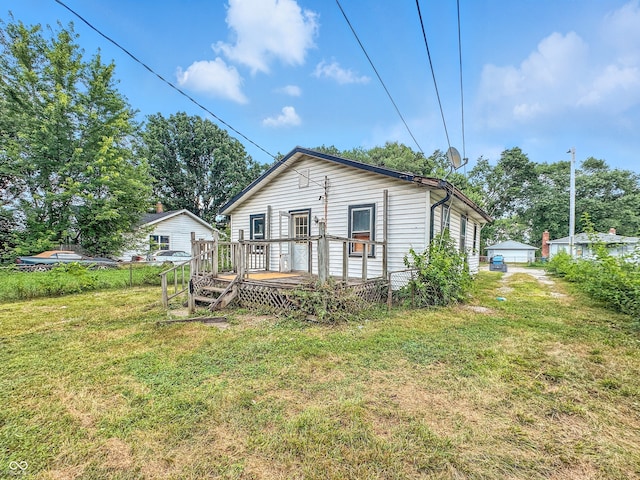 1518 S Goodlet Ave, Indianapolis, IN 46241 - rear view of house with a deck and a yard