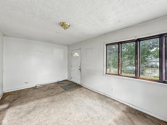 1518 S Goodlet Ave, Indianapolis, IN 46241 - carpeted foyer with a textured ceiling and baseboards
