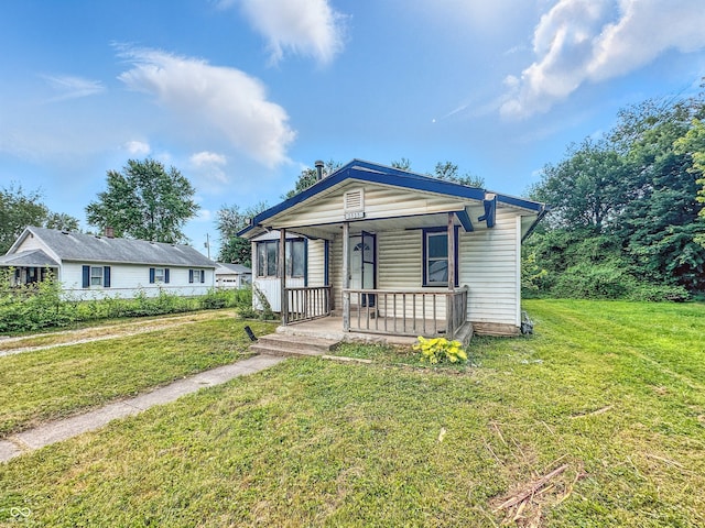 1518 S Goodlet Ave, Indianapolis, IN 46241 - view of front facade featuring covered porch and a front lawn