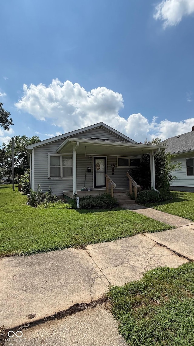 9 E Reel Ave, Vincennes, IN 47591 - view of front of house featuring a porch and a front lawn