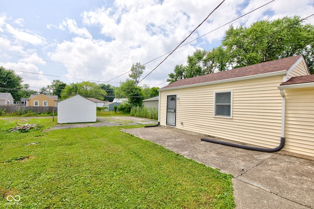 3426 N Olney St, Indianapolis, IN 46218 - view of green lawn with a shed and a patio area