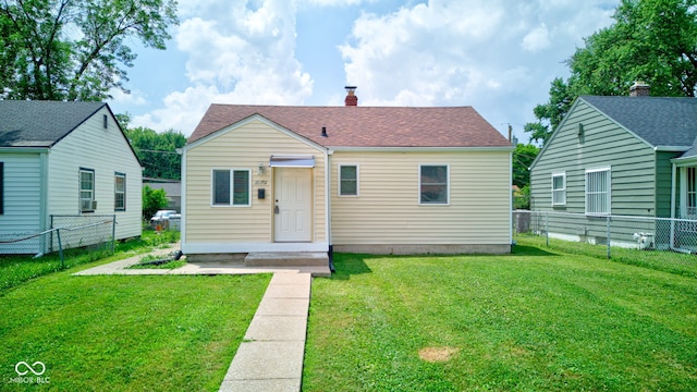 3426 N Olney St, Indianapolis, IN 46218 - bungalow-style home featuring a fenced backyard and a chimney
