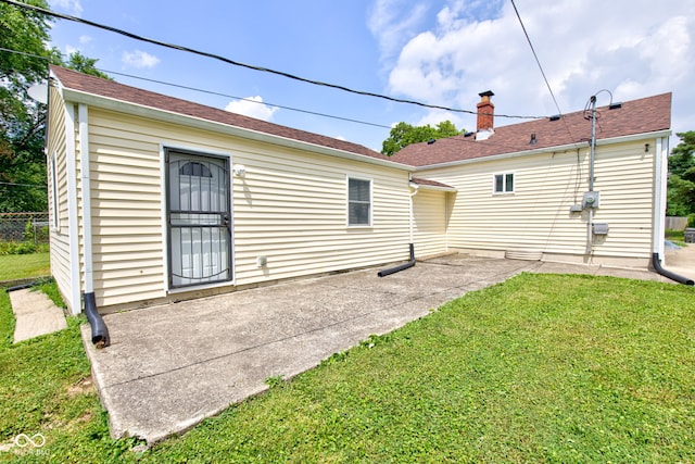 3426 N Olney St, Indianapolis, IN 46218 - rear view of property featuring a patio