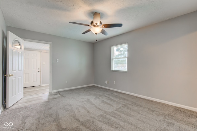 3426 N Olney St, Indianapolis, IN 46218 - carpeted spare room featuring a ceiling fan and a textured ceiling