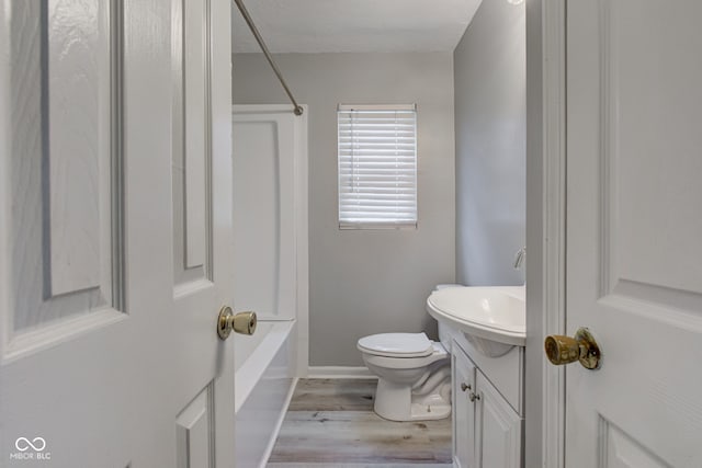 3426 N Olney St, Indianapolis, IN 46218 - bathroom with wood finished floors, vanity, and bathing tub / shower combination