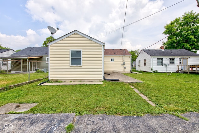 3426 N Olney St, Indianapolis, IN 46218 - back of house with a yard and a patio area
