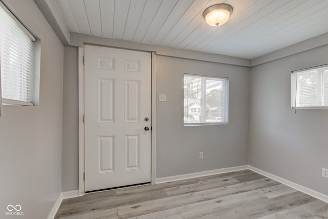 3426 N Olney St, Indianapolis, IN 46218 - foyer entrance featuring light wood-style flooring and wooden ceiling