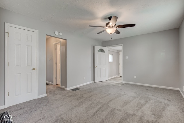 3426 N Olney St, Indianapolis, IN 46218 - unfurnished room featuring ceiling fan, carpet flooring, and a textured ceiling