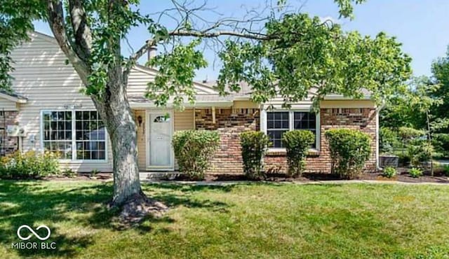 6937 Wildwood Ct, Indianapolis, IN 46268 - view of front of home with a front lawn and brick siding