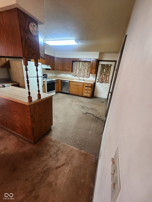 4365 Liberty Loop Rd, Martinsville, IN 46151 - kitchen with white appliances, light colored carpet, extractor fan, light countertops, and a peninsula