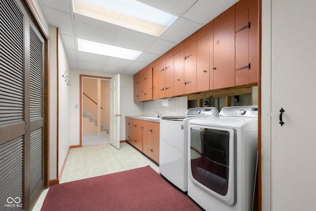 3905 Cove Rd, Columbus, IN 47203 - laundry area featuring cabinet space and independent washer and dryer