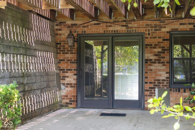 3905 Cove Rd, Columbus, IN 47203 - view of exterior entry with brick siding and french doors