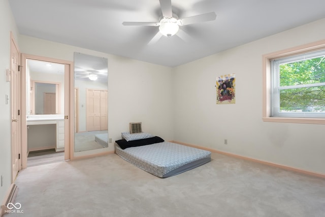 3905 Cove Rd, Columbus, IN 47203 - carpeted bedroom with ensuite bath and a ceiling fan