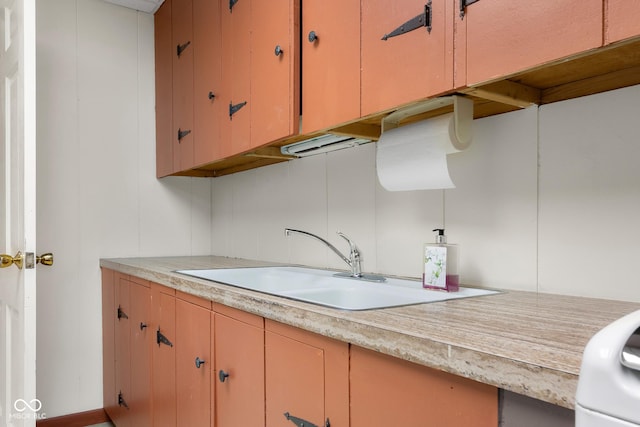 3905 Cove Rd, Columbus, IN 47203 - kitchen featuring light countertops and a sink