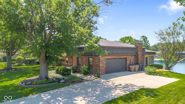 3905 Cove Rd, Columbus, IN 47203 - view of front of home featuring a garage, a front lawn, brick siding, and driveway